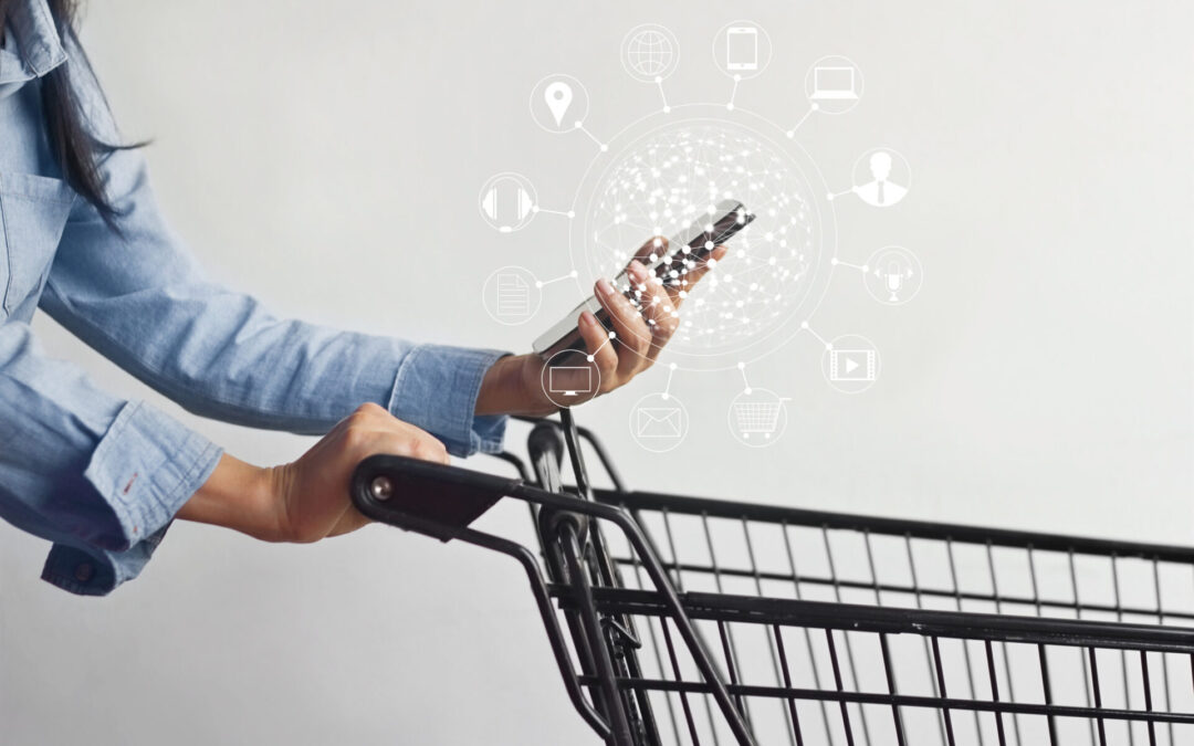 A woman pushes a shopping cart while holding a smartphone surrounded by hovering icons.